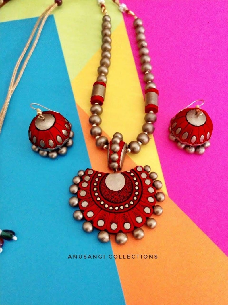 The Damayanti Mala Terracotta Jewelry set features stunning antique terracotta jewelry. Handcrafted with precision and care, this jewelry set showcases the rich cultural heritage of terracotta art. Elevate your style with this unique and timeless set that is sure to make a statement.