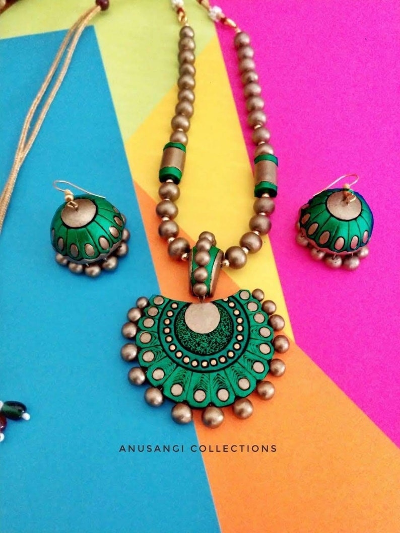 The Damayanti Mala Terracotta Jewelry set features stunning antique terracotta jewelry. Handcrafted with precision and care, this jewelry set showcases the rich cultural heritage of terracotta art. Elevate your style with this unique and timeless set that is sure to make a statement.