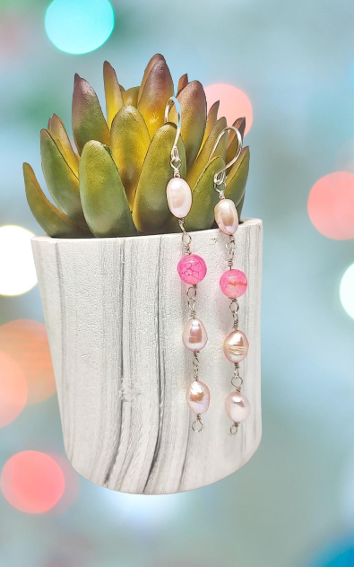 The earrings feature a striking composition of 3 pearls and 1 color of semi-precious Agate beads, creating a stand-out look that will capture attention in any crowd.