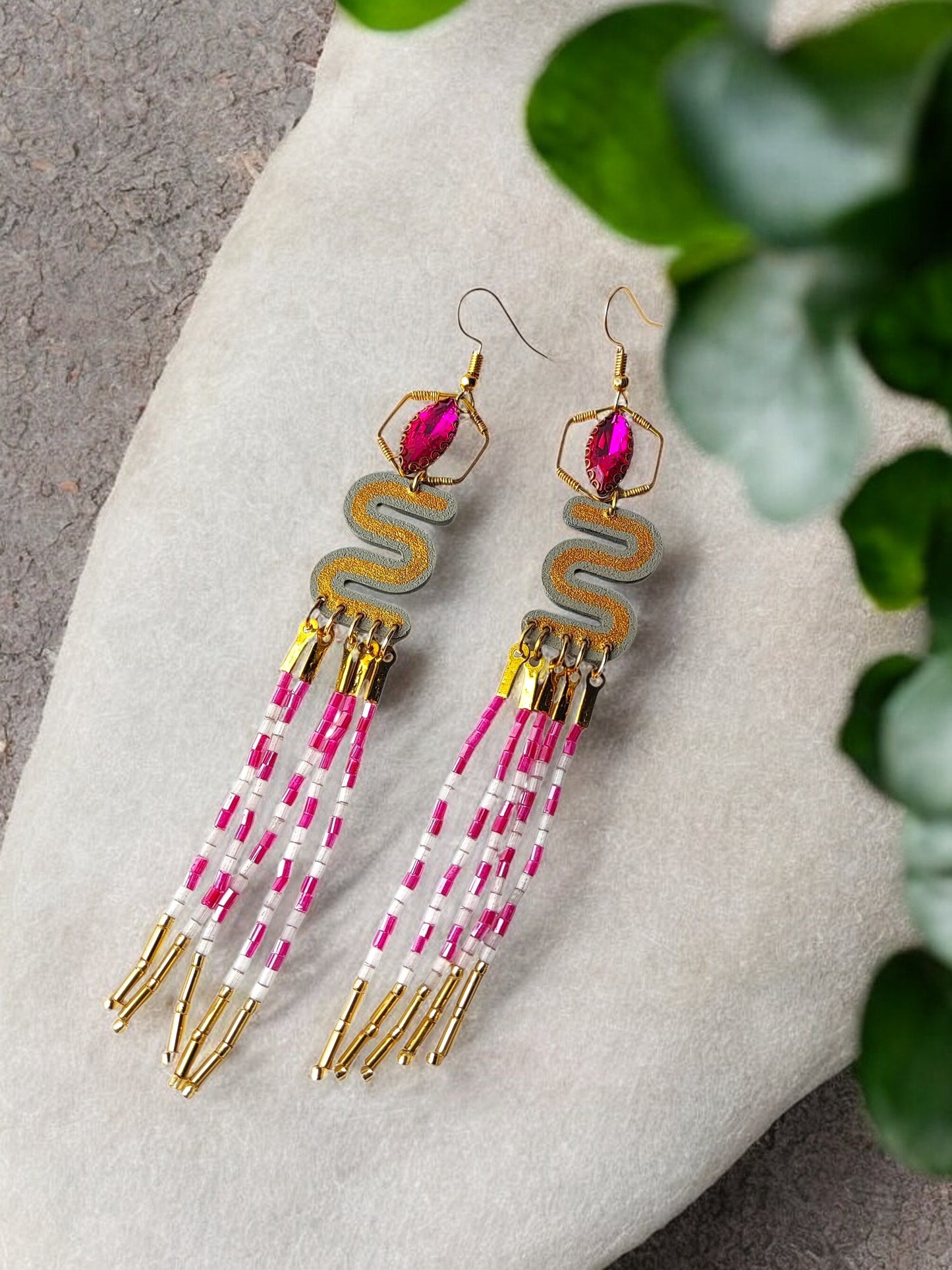 Elevate your style with the Long Beaded Earrings. Crafted with intricate beading, these earrings exude an air of sophistication and luxury. The elongated design adds a touch of elegance to any outfit, making them the perfect accessory for any occasion. Upgrade your jewelry collection with these exclusive earrings.