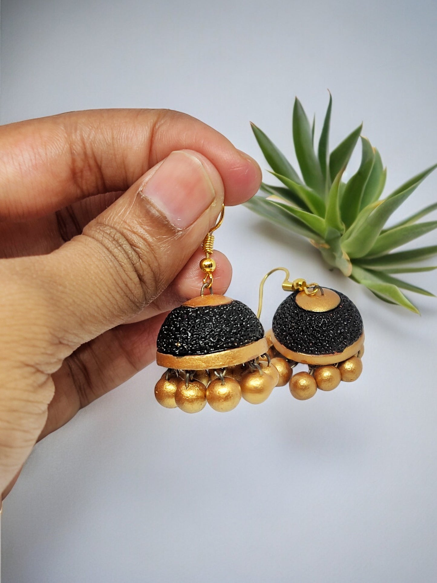 Rudraksham Jhumka Black and gold in color