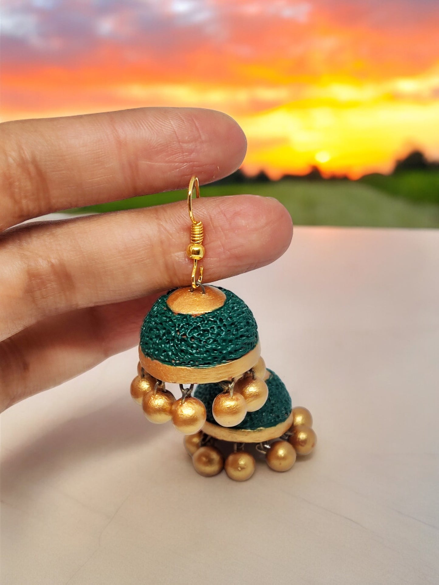 Rudraksham Jhumka green and gold in color