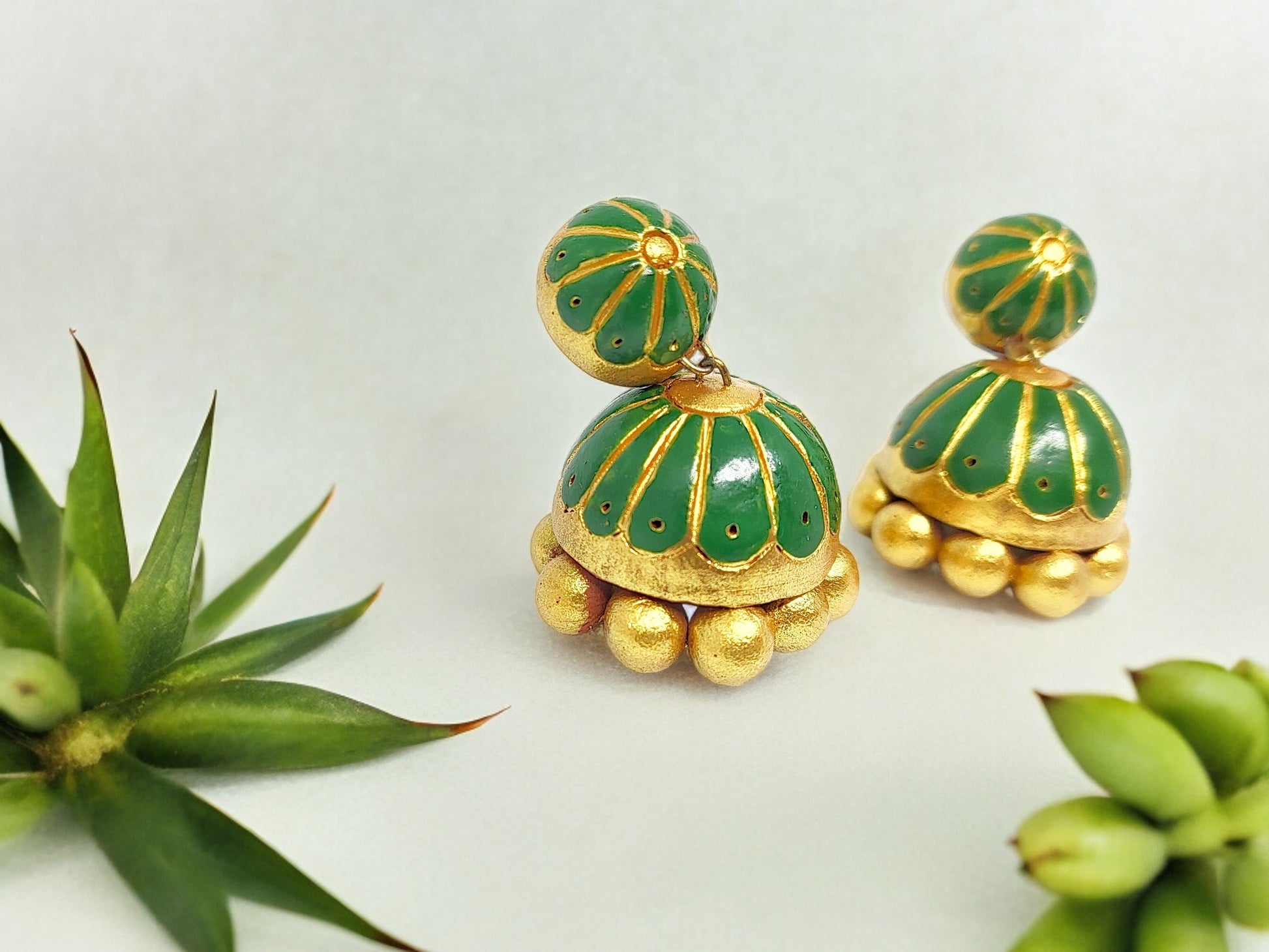 <p data-mce-fragment="1">Handcrafted with 100% care and attention to detail, the Laavanya Green Jhumka is a unique piece of jewelry. No molds were used in its creation, making each piece truly one-of-a-kind. Elevate your style with this handmade accessory.</p>