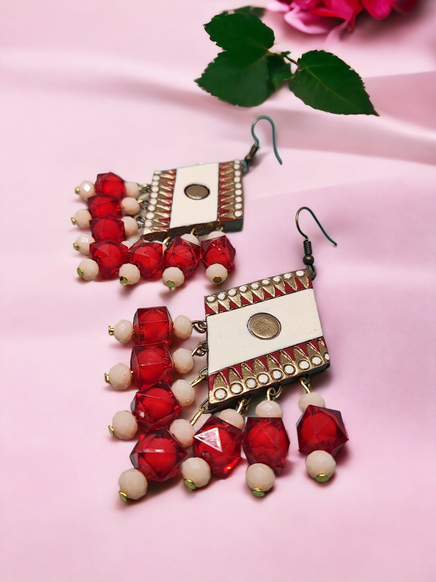 These beautiful Shri Terracotta Earrings are handmade and feature intricate terracotta designs with crystal beads that glimmer in the light. The perfect accessory for any outfit, these earrings are lightweight and comfortable for all-day wear. The unique design is eye-catching and sure to turn heads. Add a touch of elegance to your wardrobe with these stunning terracotta earrings.