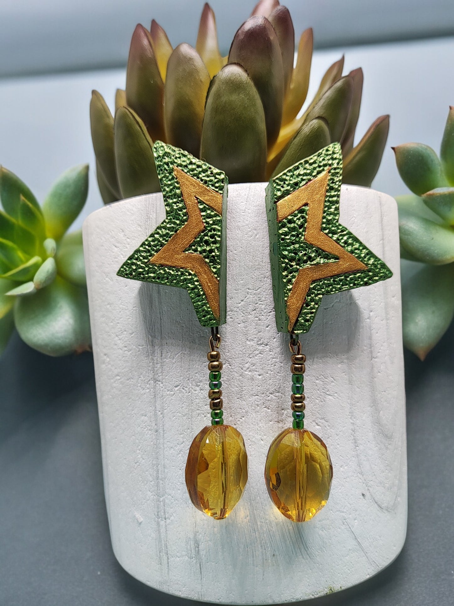 These stylish Kunjal Terracotta Earrings will add a unique and modern touch to any outfit. They come in a bright green color with a yellow gold touch, giving them a beautiful and sophisticated look. These earrings are handmade, making them a one-of-a-kind accessory that is sure to turn heads. Get your hands on this unique style of terracotta earrings and stand out from the crowd.