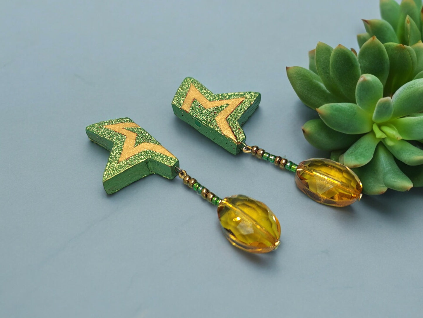 These stylish Kunjal Terracotta Earrings will add a unique and modern touch to any outfit. They come in a bright green color with a yellow gold touch, giving them a beautiful and sophisticated look. These earrings are handmade, making them a one-of-a-kind accessory that is sure to turn heads. Get your hands on this unique style of terracotta earrings and stand out from the crowd.