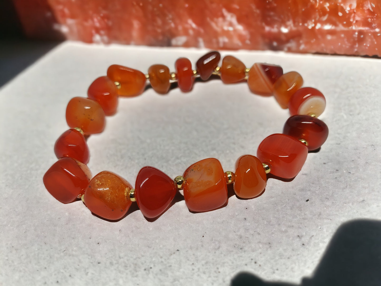 This expertly crafted Orange Nugget bracelet features genuine orange agate nugget beads for a stunning, natural look. With a variety of color options, this bracelet is a versatile accessory that will elevate any outfit. Experience the benefits of wearing beautiful and unique gemstones with this elegant bracelet.