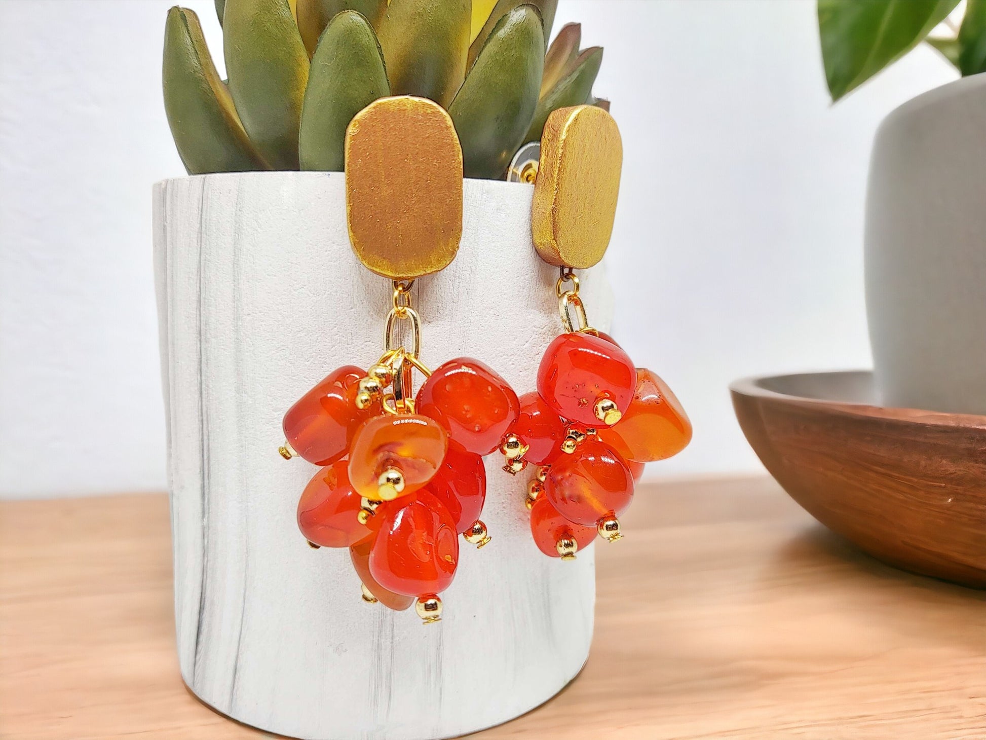 Make a statement with these Orange Nugget Earrings! Crafted with agate beads and a clay stud, these unique earrings add a pop of color to any outfit. Customize with your favorite hue and elevate your style with a touch of elegance. They are ready to ship and guaranteed to impress. Don't wait, order now!