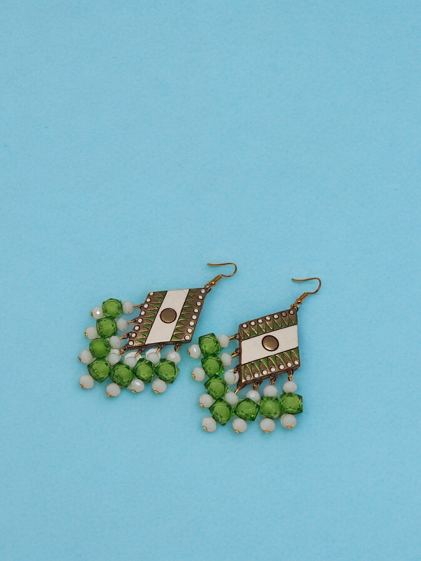 Shri Green Terracotta Earrings. Handmade with intricate designs and sparkling crystal beads, these lightweight earrings are perfect for any occasion. 