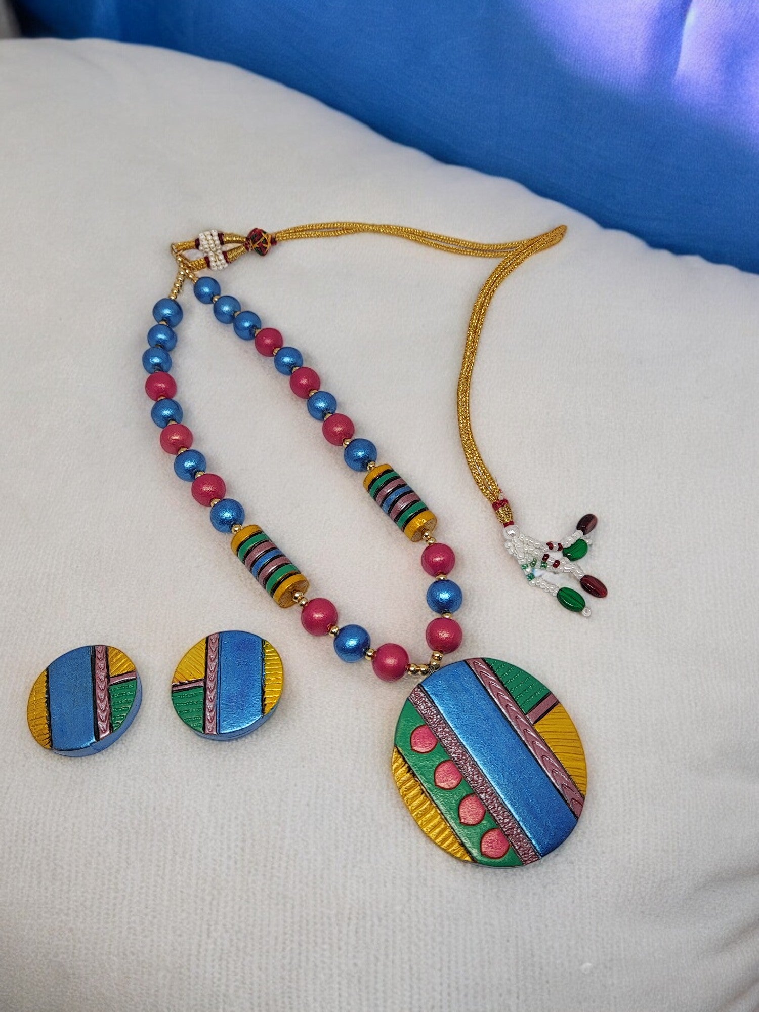 <p>Rangi Saari Atishi Princess Necklace is a colourful handmade terracotta necklace with a nice pair of earrings that will blend with your ethnic wear. Zesty colors make these necklaces fun and ultramodern on the ethnic wear. The princess length is well suited for wear with crew collars and high necklines. This product is handmade with love and attention, not mass-produced. Gifts that are handmade with love are the best gifts to give. Even gifts to yourself! Indulge in something that will please you!</p>