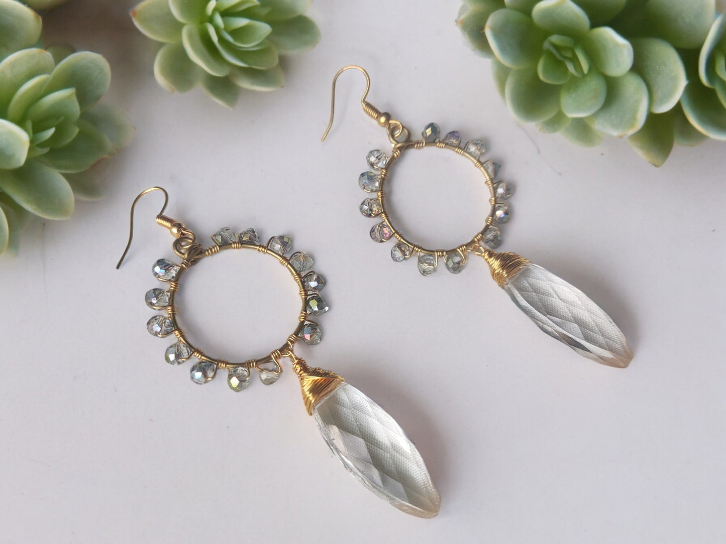 <p>Add a touch of elegance to your outfit with our Clear Crystal Beaded Earrings. Each piece is handcrafted with utmost care, making every pair unique. These earrings are perfect for any occasion, whether it's a night out with friends or a formal event. The lightweight design ensures comfortable wear throughout the day. These earrings are a must-have addition to any fashion-forward wardrobe.</p>