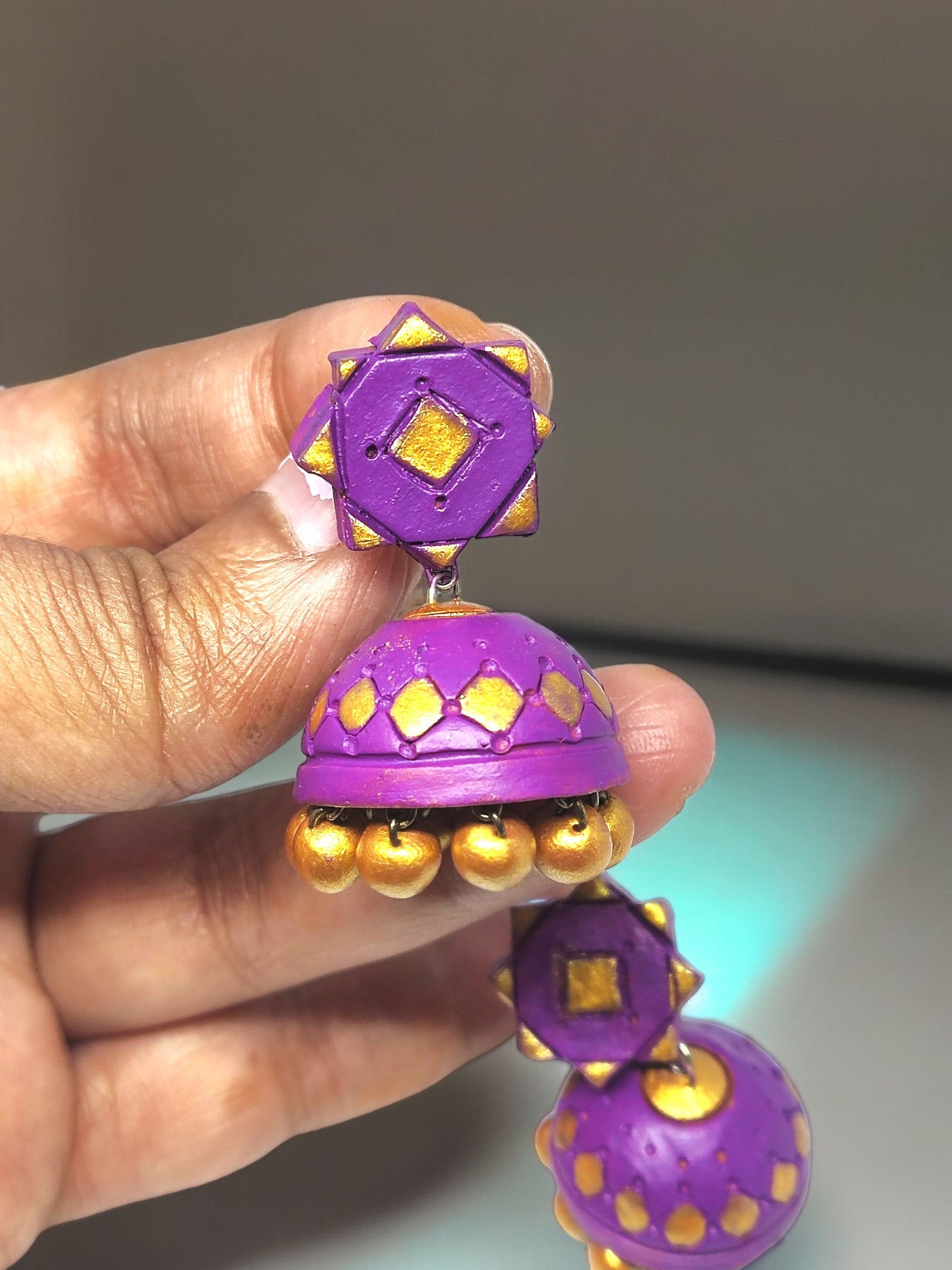 Add a pop of color to your outfit with these elegant Purple Terracotta Earrings. Made from high-quality terracotta, these earrings are durable and lightweight. The vibrant purple hue will complement any skin tone, making them a versatile addition to your jewelry collection. Upgrade your style with these must-have earrings.