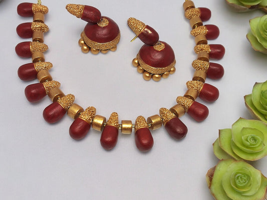 Indulge in sophistication with our luxurious Aesthetic Classic Maroon and Gold Terracotta Jewelry Set. Meticulously crafted with intricate maroon and gold details, this set exudes elegance and elevates any outfit. Handcrafted with premium terracotta, it is lightweight and exceptionally comfortable to wear. A versatile and essential addition to your jewelry collection, perfect for all occasions.