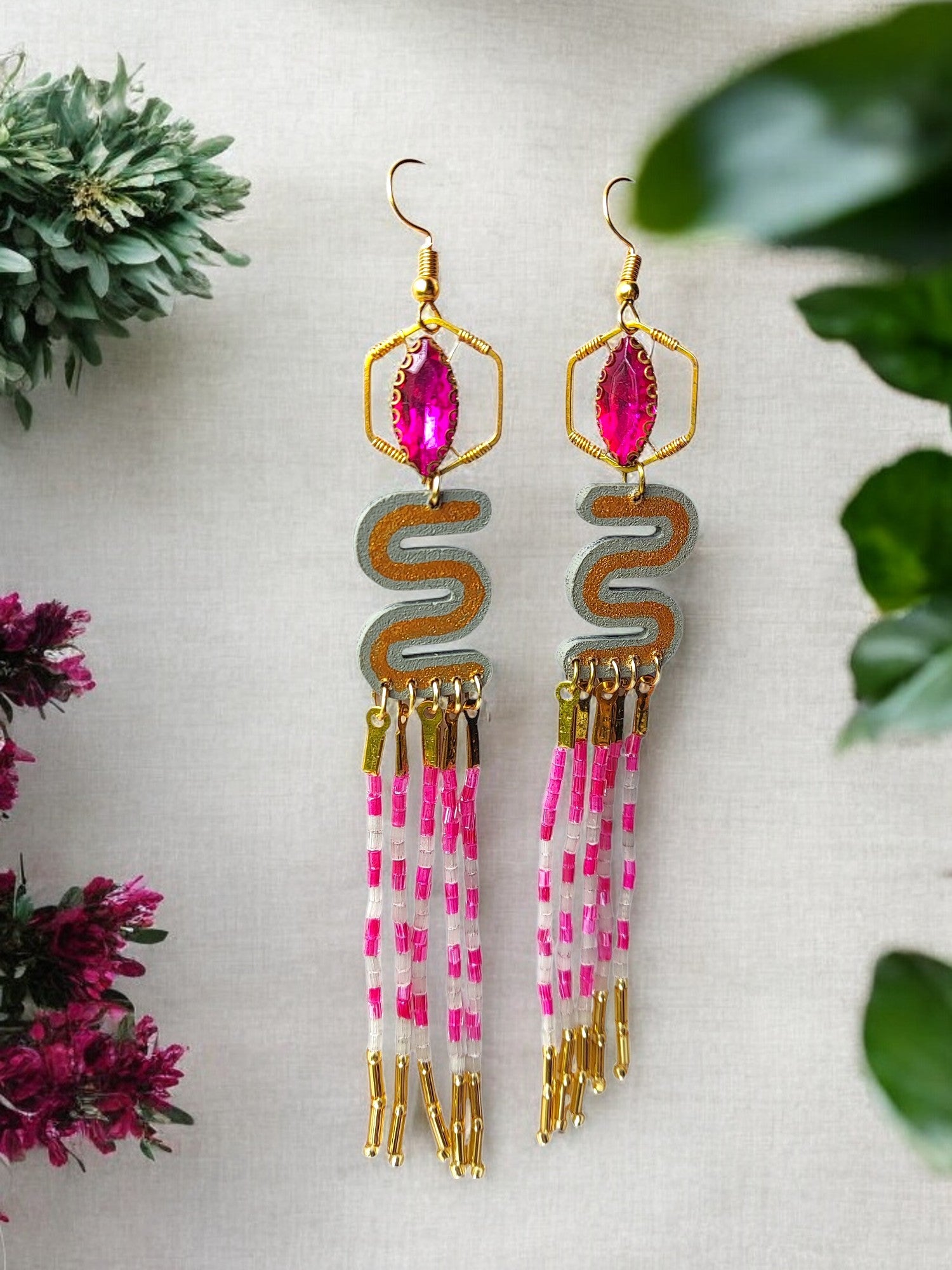 Elevate your style with the Agatha Long Beaded Earrings. Crafted with intricate beading, these earrings exude an air of sophistication and luxury. The elongated design adds a touch of elegance to any outfit, making them the perfect accessory for any occasion. Upgrade your jewelry collection with these exclusive earrings.