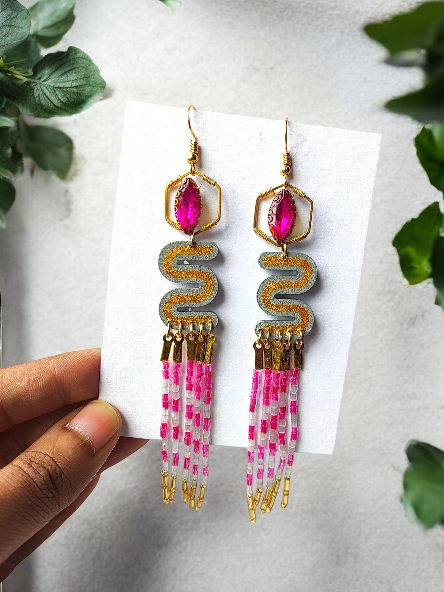 Elevate your style with the Long Beaded Earrings. Crafted with intricate beading, these earrings exude an air of sophistication and luxury. The elongated design adds a touch of elegance to any outfit, making them the perfect accessory for any occasion. Upgrade your jewelry collection with these exclusive earrings.