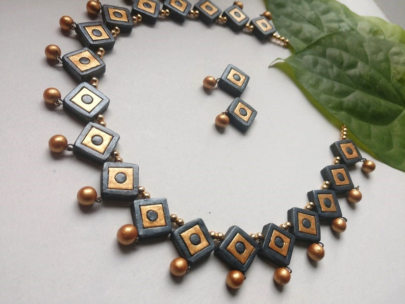 Perfect for any occasion, Indrasenaa Varga Terracotta Necklace set is versatile, elegant, and lightweight. Its comfortable design allows it to complement any outfit effortlessly. Expertly crafted using high-quality terracotta, this necklace set is a must-have for any fashion-forward individual.